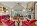 Spacious living room with vaulted ceiling and cozy stone fireplace at 363 Rolling Meadows Ln, Chapel Hill, NC 27517