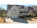 Charming two-story home with a two-car garage, front porch, and well-maintained landscaping at 3633 Jordan Shires Dr, New Hill, NC 27562