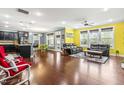 Bright open-concept living room features hardwood floors, modern decor, and abundant natural light at 424 Hopwood Way, Apex, NC 27523