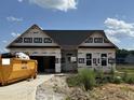 New construction home featuring a spacious two-car garage and classic architectural details at 472 Springtooth Dr, Zebulon, NC 27597