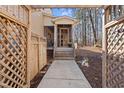 Charming front entrance framed by a decorative wooden gate and a landscaped walkway at 6301 King Lawrence Rd, Raleigh, NC 27607