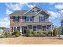 Attractive two-story home featuring stone accents, neutral siding, and well-maintained landscaping at 710 Legacy Falls S S Dr, Chapel Hill, NC 27517