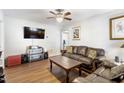 Inviting living room with a ceiling fan, entertainment center, and leather sofa at 805 S 11Th St, Lillington, NC 27546