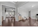 Spacious living room showcasing hardwood floors, an open layout, and neutral paint that offers versatile decorating options at 1028 Allaire Dr, Raleigh, NC 27603