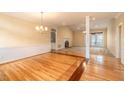 Spacious living room featuring hardwood floors, fireplace, and natural light at 2504 Churchill Dr, Burlington, NC 27215