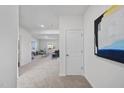 Inviting entryway featuring neutral carpet and an open floorplan leading to the living area at 3517 Strawberry Patch Row, Raleigh, NC 27604