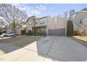 Charming two-story home featuring a welcoming front porch, a two car garage, and manicured landscaping at 3621 Colby Chase Dr, Apex, NC 27539