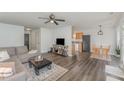 Open-concept living room with modern decor and wood-look flooring at 38 Colonial Hills Dr, Lillington, NC 27546