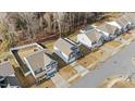 Aerial view of a residential neighborhood with well-maintained homes and fenced yards at 3800 Cross Timber Ln, Raleigh, NC 27603