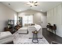 Bright living room with vaulted ceilings, a cozy sectional, and stylish decor at 5 Morning Dove Ct, Clayton, NC 27520