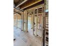 Interior view of home under construction with visible framework and staircase access at 108 Pointe Park Cir, Holly Springs, NC 27540