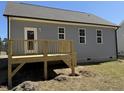 Backyard deck with natural wood finish, accessible from the house and overlooking the backyard at 119 Daniel St, Oxford, NC 27565