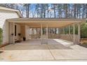 Large carport offers ample covered parking space with a latticed design and outdoor entry at 1203 Brookgreen Dr, Cary, NC 27511