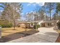 Attractive single-Gathering home featuring a carport, long driveway and landscaped front yard at 1203 Brookgreen Dr, Cary, NC 27511