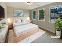 Inviting bedroom with a plush bed, soft lighting, and large windows at 135 N Ridge View Way, Franklinton, NC 27525