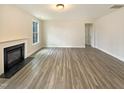 Living room featuring a fireplace and neutral walls and flooring at 135 N Ridge View Way, Franklinton, NC 27525