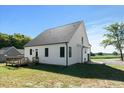 Side view of home shows a wooden deck in the backyard at 1467 Antioch Church Rd, Timberlake, NC 27583