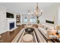 Bright living room with hardwood floors, fireplace, and contemporary furnishings at 182 Inverness St, Zebulon, NC 27597