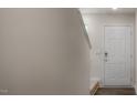 Entryway with light gray walls, a white paneled door, and wood-look flooring at 194 Oak Barrel Rd, Smithfield, NC 27577