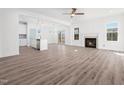 Bright and open living room with fireplace, wood flooring, and an abundance of natural light at 20 Wildflower Ln, Franklinton, NC 27525