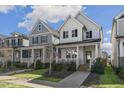 View of charming homes with inviting front porches and landscaped yards in a sunny neighborhood at 237 Daniel Ridge Rd, Wendell, NC 27591