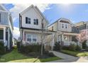 Charming home with a welcoming front porch, complemented by a well-maintained lawn and blue skies at 237 Daniel Ridge Rd, Wendell, NC 27591