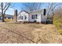Charming white house showcasing a manicured lawn and classic architectural design, perfect for a Gathering home at 307 Gordon St, Roxboro, NC 27573