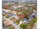 Beautiful aerial view of home at 325 Hogans Valley Way, situated near the #9 Fairways in a landscaped neighborhood at 325 Hogans Valley Way, Cary, NC 27513