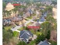 Beautiful aerial view of 325 Hogans Valley Way situated on the golf course with mature trees and lush landscaping at 325 Hogans Valley Way, Cary, NC 27513