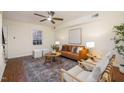 Bright living room boasts a stylish rug, comfortable seating, and a ceiling fan at 4705 Blue Bird Ct # C, Raleigh, NC 27606