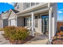 Inviting covered front porch with a cozy seating area, a 'Welcome' sign, and manicured landscaping at 642 Thistle Dr, Burlington, NC 27217