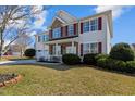 Charming two-story home boasts a well-manicured lawn and a convenient two-car garage at 80 Ingle View Ct, Burlington, NC 27215
