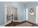 Welcoming foyer with elegant glass doors and beautiful hardwood floors that create a grand entrance at 80 Ingle View Ct, Burlington, NC 27215