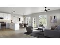Bright and airy living room featuring sleek furniture, modern lighting, and an open concept kitchen and dining area at 1032 Harper Rd, Raleigh, NC 27603