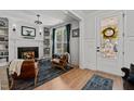 Inviting living room features a cozy fireplace, elegant built-in shelving, and ample natural light at 112 Rawhide Dr, Louisburg, NC 27549
