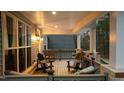 Relaxing porch with wooden floors, comfy chairs, and scenic views at 112 Rawhide Dr, Louisburg, NC 27549