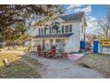 Charming two-story building with white siding, green shutters, and appealing business frontage at 120 Lake Orange Rd, Hillsborough, NC 27278