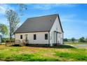A sprawling backyard featuring a wooden deck perfect for outdoor entertaining at 1403 Antioch Church Rd, Timberlake, NC 27583