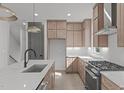 Spacious kitchen with a center island, stainless steel appliances, and modern finishes at 228 Woodsborough Pl, Raleigh, NC 27601