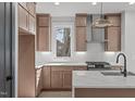 Bright kitchen featuring shaker cabinets, stainless appliances, and white quartz countertops at 228 Woodsborough Pl, Raleigh, NC 27601