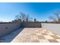 Beautiful rooftop deck with wood pavers and a downtown view at 228 Woodsborough Pl, Raleigh, NC 27601