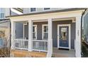 Inviting front porch featuring stylish furniture and a cozy rug, perfect for relaxing outdoors at 283 Dry Canyon Dr, Wendell, NC 27591