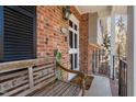 Charming front porch features a wooden bench, brick facade, and inviting entryway at 330 Wesley Dr, Chapel Hill, NC 27516