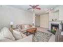 Inviting living room with neutral paint, fireplace, and comfortable seating arrangement at 622 Ives Ct # 622, Chapel Hill, NC 27514
