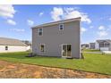 A spacious backyard with a sliding glass door for easy access at 704 Rhino Bnd, Oxford, NC 27565