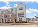 Attractive three-story townhome with neutral siding and brick accents, in a desirable neighborhood at 111 Hickory Plains Rd, Knightdale, NC 27545