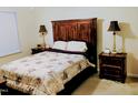 Comfortable main bedroom with a decorative headboard and matching bedside tables with lamps at 1141 Early Rise St, Raleigh, NC 27610