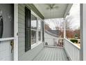 View of covered porch with ceiling fan, railings, and an outside view at 1821 Kelly Glen Dr, Apex, NC 27502