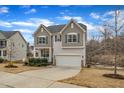 Beautiful two-story home with a front porch and a two-car garage, nestled on a well-manicured lot at 274 Roaring Creek Dr, Garner, NC 27529