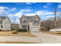 Attractive two-story home featuring a covered front porch and an attached two-car garage at 274 Roaring Creek Dr, Garner, NC 27529